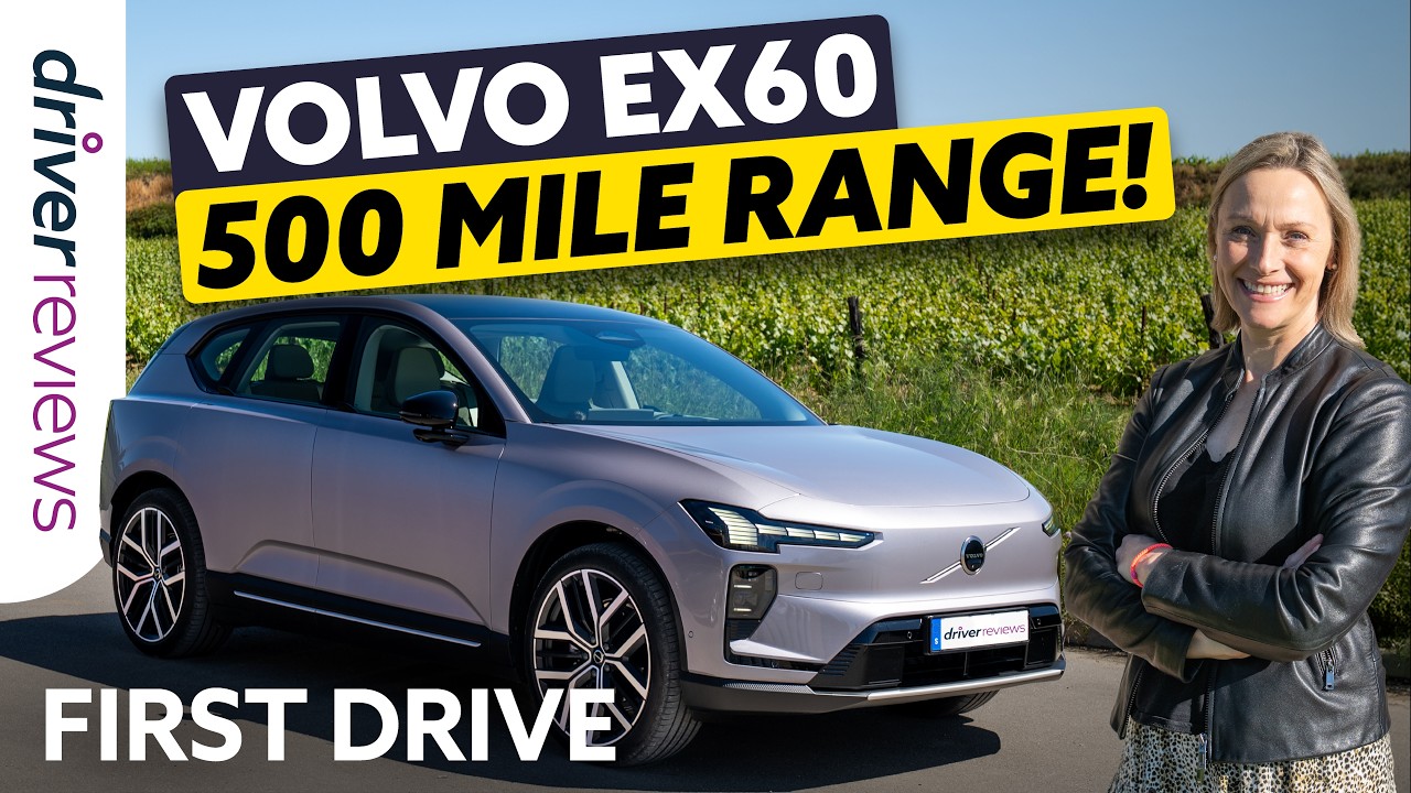Silver Volvo EX60 SUV beside a vineyard with a bold yellow banner reading '500 MILE RANGE' and 'FIRST DRIVE' text—review thumbnail